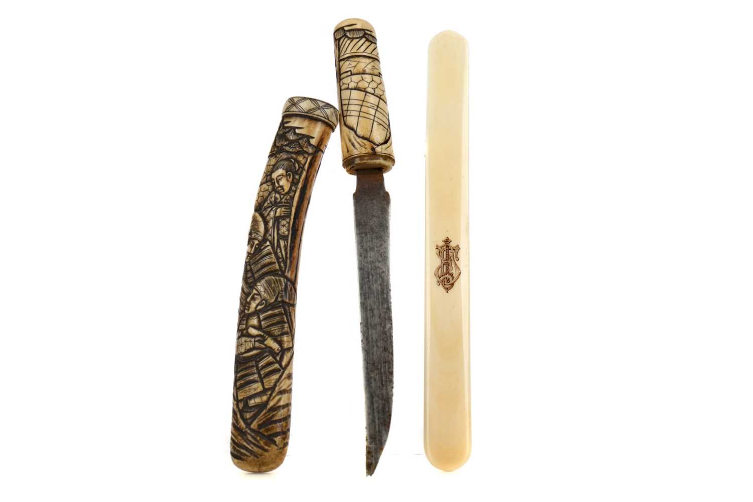 Lot 650 - AN EARLY 20TH CENTURY JAPANESE IVORY TANTO AND AN IVORY PAGE TURNER