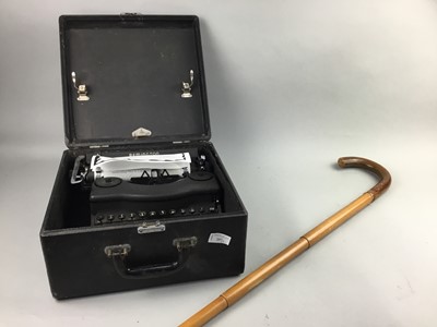 Lot 257 - A REMINGTON TYPEWRITER, ALONG WITH A WALKING STICK/UMBRELLA