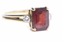 Lot 83 - GARNET AND DIAMOND RING the central emerald...