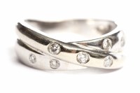 Lot 89 - DIAMOND RING with seven countersunk round...