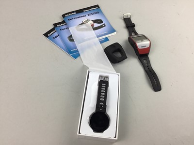 Lot 406 - A SMART BRACELET FITNESS WATCH ALONG WITH A GARMIN FORERUNNER