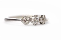 Lot 103 - DIAMOND THREE STONE RING the graduated stones...