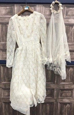 Lot 471 - A VINTAGE LACE WEDDING DRESS AND VAIL