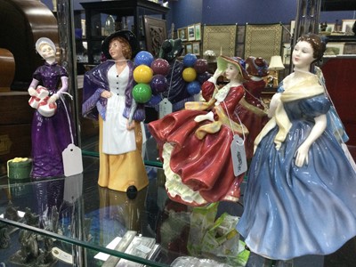 Lot 447 - A ROYAL DOULTON FIGURE OF 'BALLOON LADY' AND THREE OTHERS