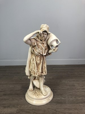 Lot 296 - A 20TH CENTURY POTTERY FIGURE OF A MAN WITH AMPHORA
