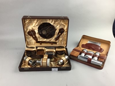 Lot 534 - A SIMULATED TORTOISESHELL VANITY SET IN FITTED CASE AND ANOTHER