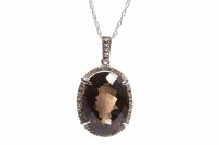 Lot 119 - SMOKY QUARTZ AND DIAMOND SET PENDANT set with...