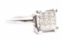 Lot 120 - DIAMOND RING the square bezel with nine...