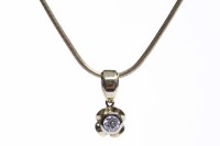 Lot 124 - DIAMOND SINGLE STONE PENDANT set with a round...