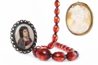 Lot 125 - EARLY TWENTIETH CENTURY FACETED BAKELITE...
