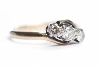 Lot 133 - DIAMOND THREE STONE RING set with graduated...