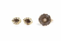 Lot 138 - SMOKY QUARTZ SET RING set with a large round...