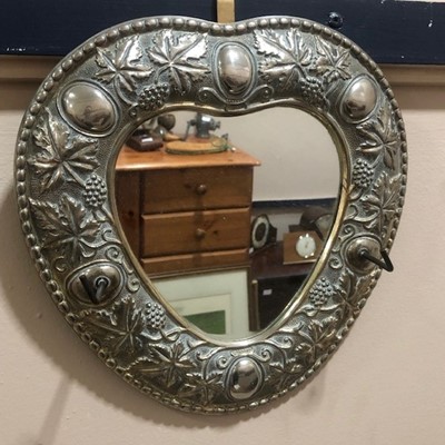 Lot 575 - A SILVER PLATED HEART SHAPED WALL MIRROR