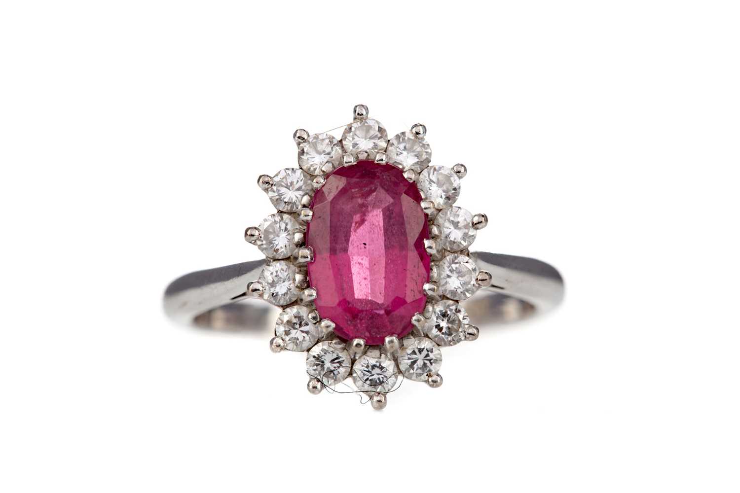 Lot 398 - A RUBY AND DIAMOND CLUSTER RING