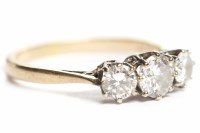 Lot 148 - DIAMOND THREE STONE RING the central brilliant...