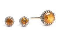 Lot 149 - GEM SET CLUSTER RING set with a single orange...