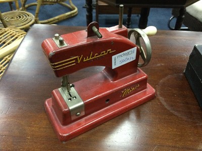 Lot 560A - A MINIATURE VULCAN SEWING MACHINE AND A GAMES SET