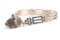 Lot 151 - NINE CARAT GOLD GATELINK BRACELET with a...
