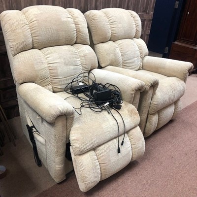 Lot 596 - A PAIR OF POWER RECLINER ARMCHAIRS