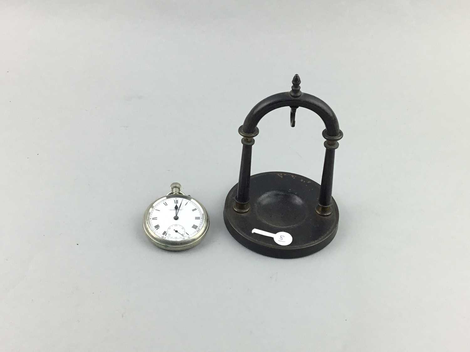 Lot 11 - A POCKET WATCH ON STAND