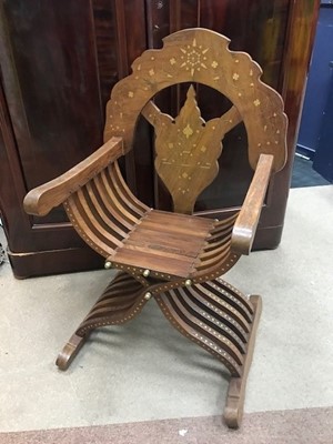 Lot 246A - AN EASTERN BRASS INLAID ARMCHAIR