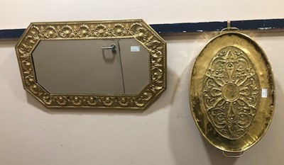 Lot 133 - AN ARTS & CRAFTS EMBOSSED BRASS OVAL TRAY AND A BRASS WALL MIRROR