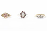 Lot 172 - THREE TWENTIETH CENTURY DRESS RINGS comprising...