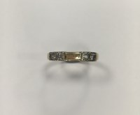 Lot 181 - DIAMOND SET WEDDING BAND set with four...