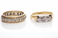 Lot 183 - MID-TWENTIETH CENTURY DIAMOND THREE STONE RING...