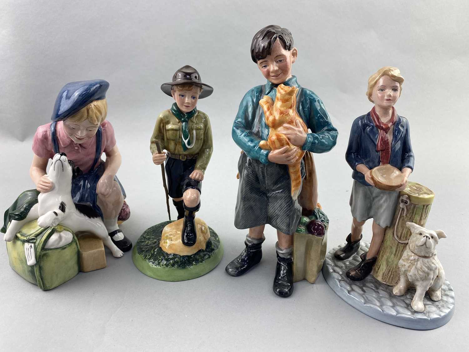 Lot 165 - A ROYAL DOULTON FIGURE OF 'PLEASE SIR' AND THREE OTHERS
