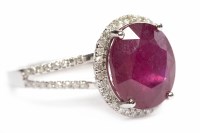 Lot 193 - RUBY AND DIAMOND DRESS RING set with a single...