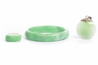 Lot 196 - GREEN HARDSTONE BANGLE 77mm diameter; along...