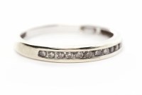 Lot 201 - DIAMOND SET BAND with channel set round...