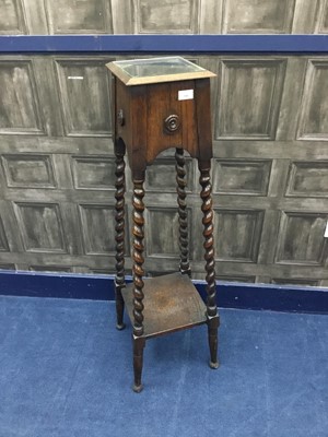 Lot 310 - AN OAK JARDINIERE STAND