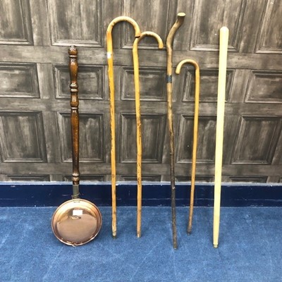 Lot 342 - A 20TH CENTURY COPPER BED WARMING PAN AND VARIOUS WALKING STICKS