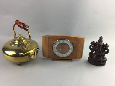 Lot 380 - A VICTORIAN BRASS TEA KETTLE, MANTEL CLOCK AND A CARVED FIGURE