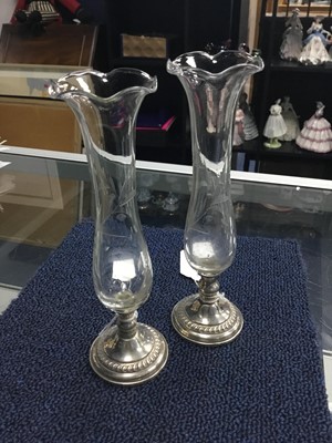 Lot 224 - A PAIR OF GLASS BUD VASES