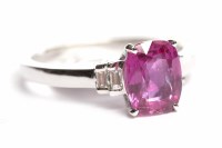 Lot 221 - PINK SAPPHIRE AND DIAMOND RING the central...