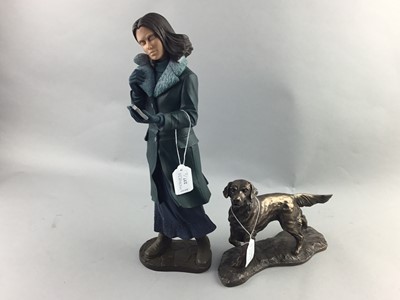 Lot 237 - A RESIN FIGURE MODELLED AS A WOMAN READING A BOOK