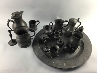 Lot 429 - AN EARLY 19TH CENTURY PEWTER CHARGER, JUGS AND MEASURES