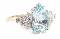 Lot 232 - AQUAMARINE AND DIAMOND RING the central pear...