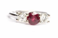 Lot 235 - RUBY AND DIAMOND THREE STONE RING the central...