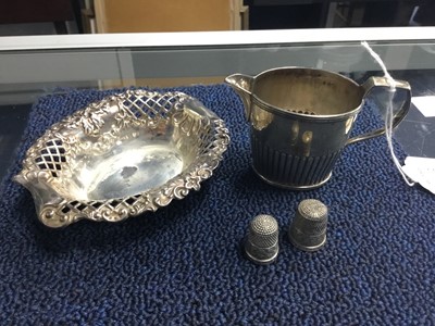 Lot 507 - A SILVER CREAM JUG, BONBON DISH AND THIMBLES