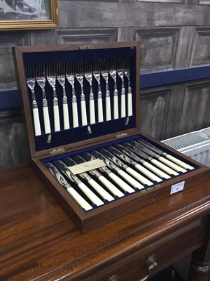 Lot 511 - A SET OF PLATED FISH KNIVES AND FORKS