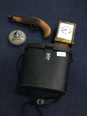 Lot 542 - A BRASS CARRIAGE CLOCK, BINOCULARS, NOVELTY PISTOL AND A PAPERWEIGHT