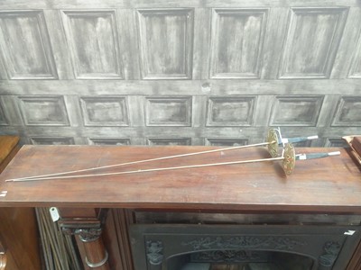 Lot 567 - A PAIR OF REPRODUCTION FENCING SWORDS