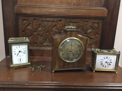 Lot 569 - A BRASS CARRIAGE CLOCK, TWO OTHER MANTEL CLOCKS AND A BAROMETER