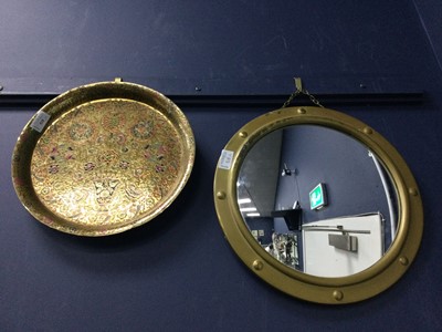 Lot 518 - A BRITISH INDIAN CHASED ENAMEL BRASS CIRCULAR WALL PLAQUE