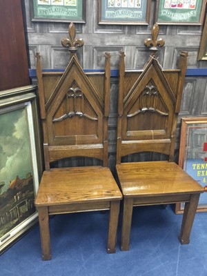 Lot 80A - A PAIR OF EARLY 20TH CENTURY OAK HALL CHAIRS