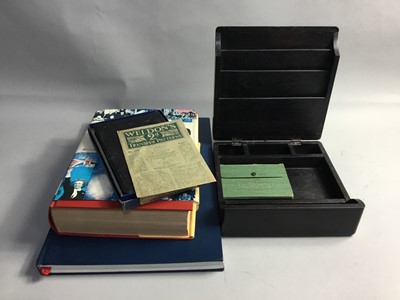 Lot 124 - A SMALL FOLDER OF STAMPS, ALONG WITH THREE BOOKS
